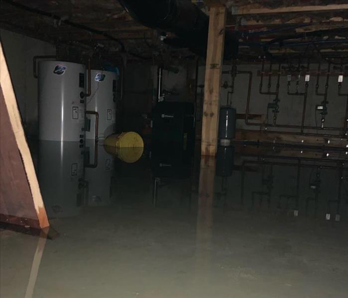 Flooded crawlspace with a few inches of water.