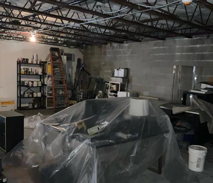 Warehouse with a table covered in plastic 