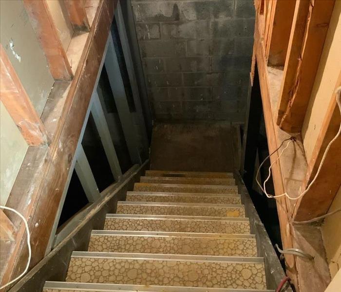 Basement staircase with exposed framework