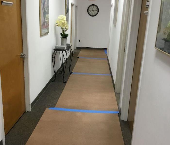 Office hallway with wet carpet