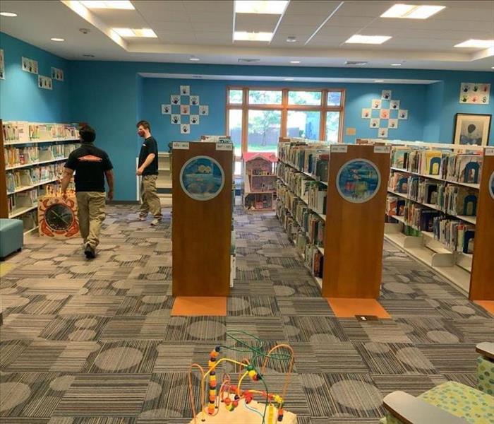 SERVPRO techs inspecting a library