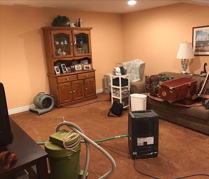 SERVPRO drying equipment in a furnished room