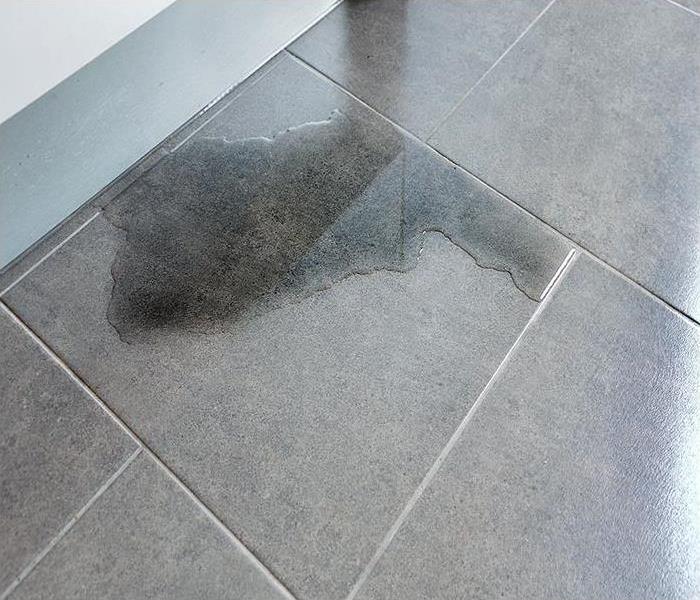 water covering tile flooring