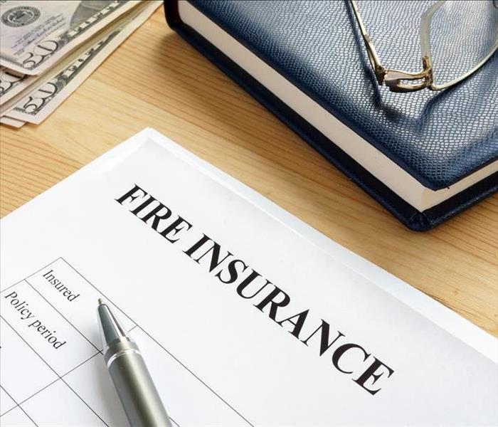 fire insurance form and pen,money